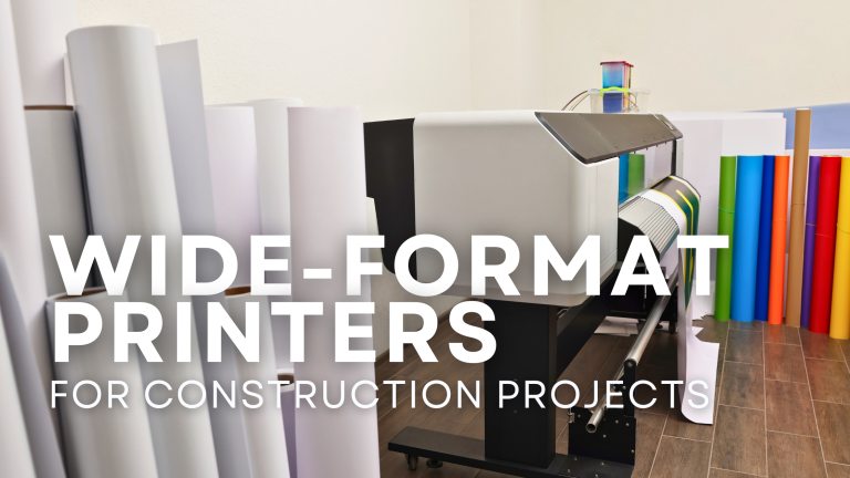 "Side view of a large format printer with white paper rolls in front and colorful rolls in the background, showcasing the printer’s wide-format capacity and design in Atlanta